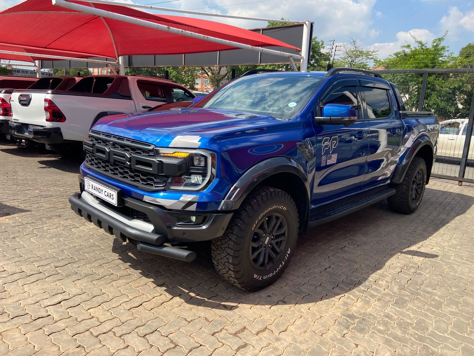 
								2025 Ford Ranger 3.0T V6 Double Cab Raptor 4WD,Leather interior, Electric windows,Navigation, ,Reverse Camera ,PDC Sensor etc… We give amazing discounts on cash deals! Free delivery guaranteed around Gauteng province only. We also arrange finance through all major Banks. We give 24hrs turn around period for finance applicants and same time delivery on cash deals. Contact our sales team ..You can visit us at 541 Louis Botha Ave, savoy estate full									