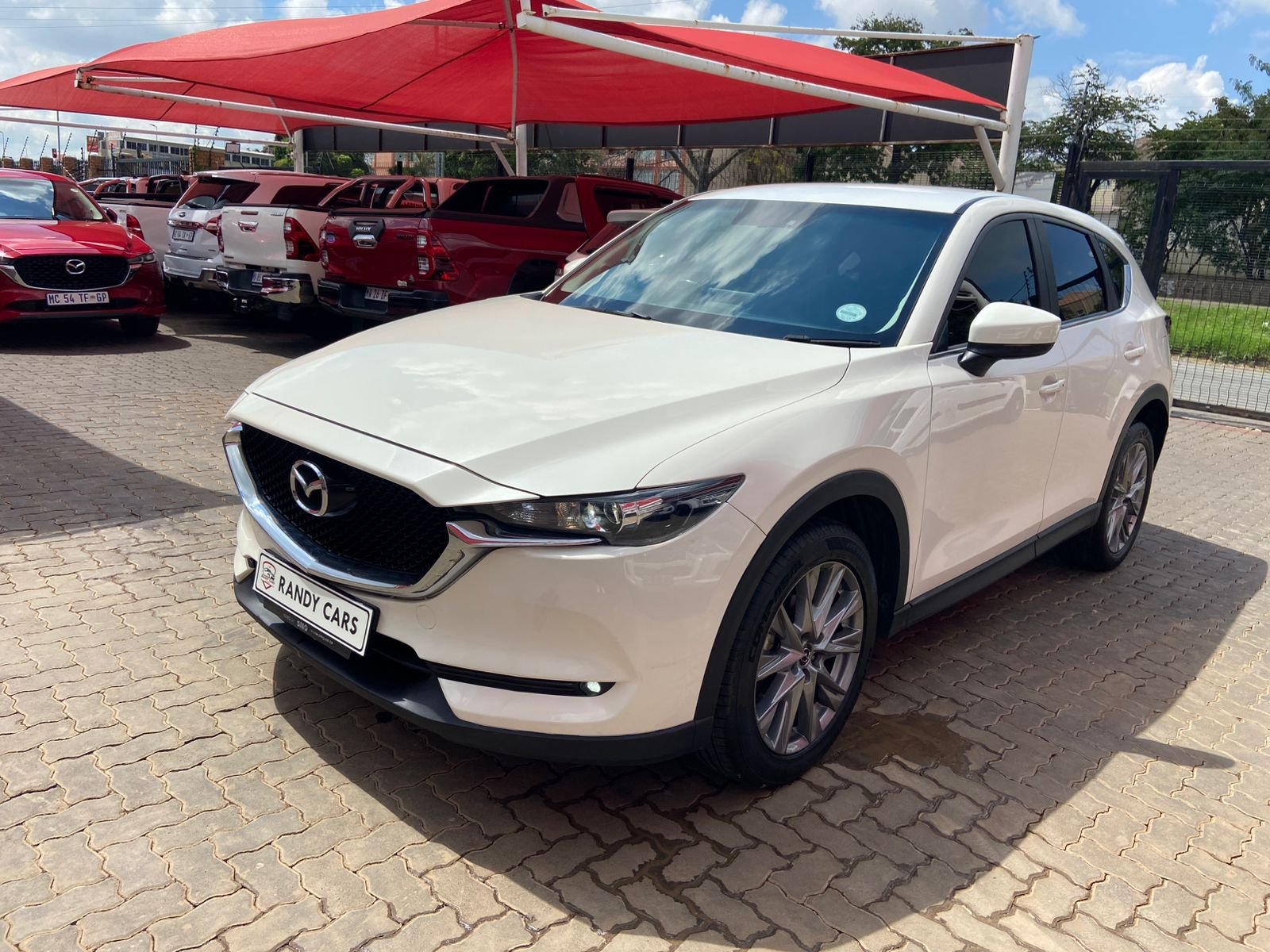 
								2021 Mazda CX-5 Active 2.0 Auto,Leather interior,electric windows,aircon etc… we give amazing discounts on cash deals! free delivery guaranteed around gauteng province only. we also arrange finance through all major banks. we give 24hrs turn around period for finance applicants and same time delivery on cash deals. contact our sales team ZANDI….. full									