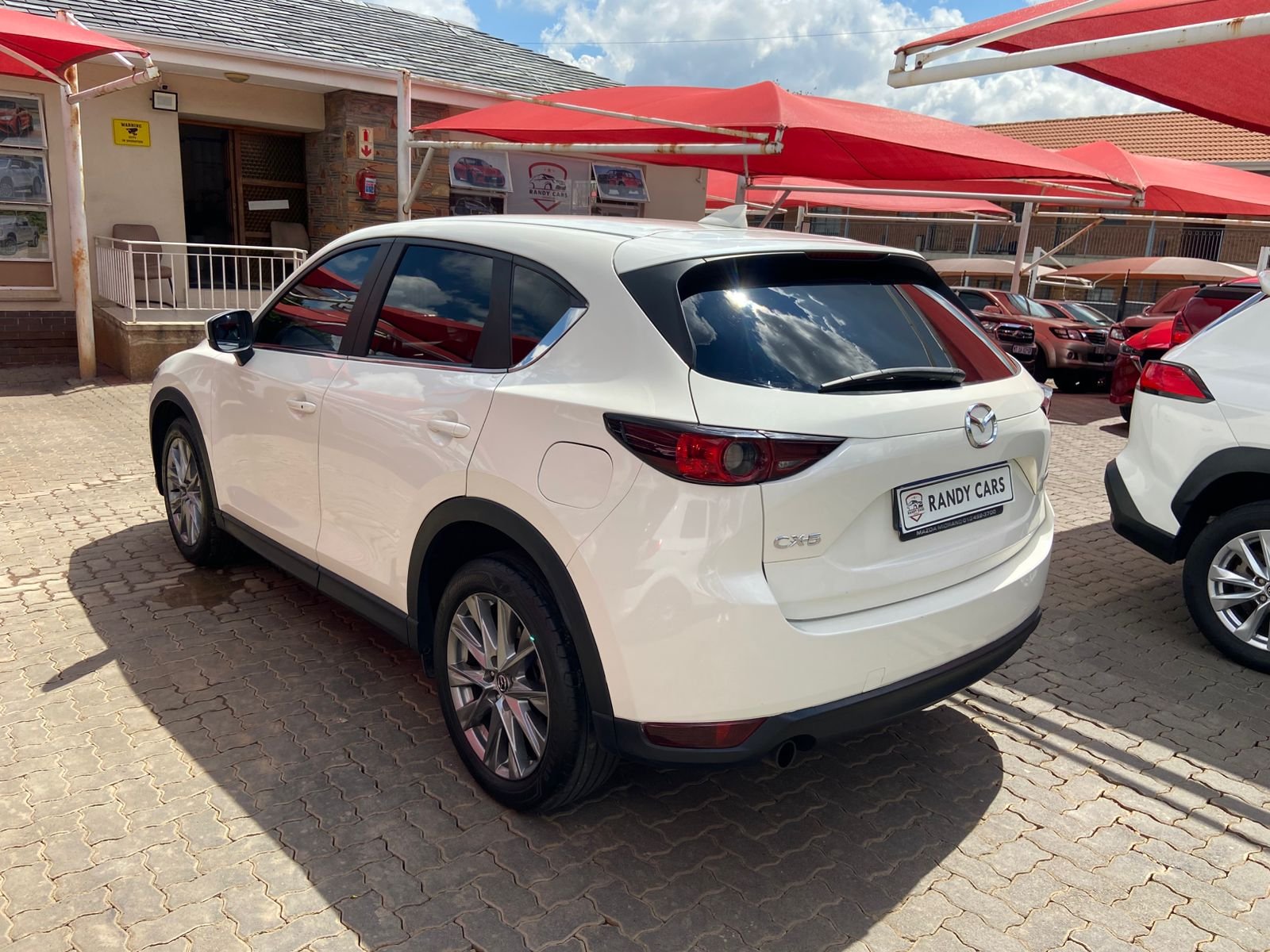 
								2021 Mazda CX-5 Active 2.0 Auto,Leather interior,electric windows,aircon etc… we give amazing discounts on cash deals! free delivery guaranteed around gauteng province only. we also arrange finance through all major banks. we give 24hrs turn around period for finance applicants and same time delivery on cash deals. contact our sales team ZANDI….. full									